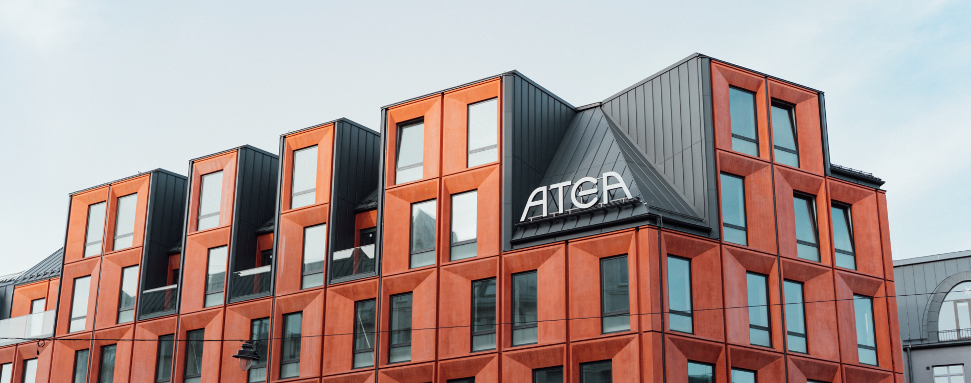 Atea office building exterior with modern red facade and Atea signage.